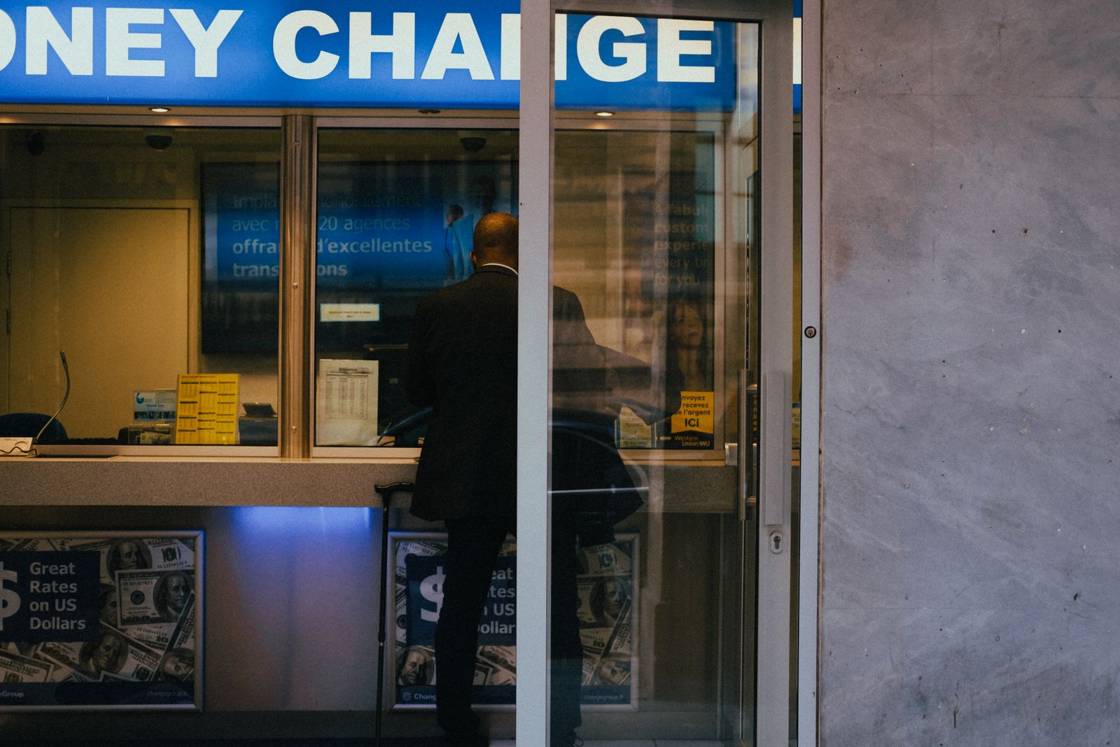 A person at a money-change counter
