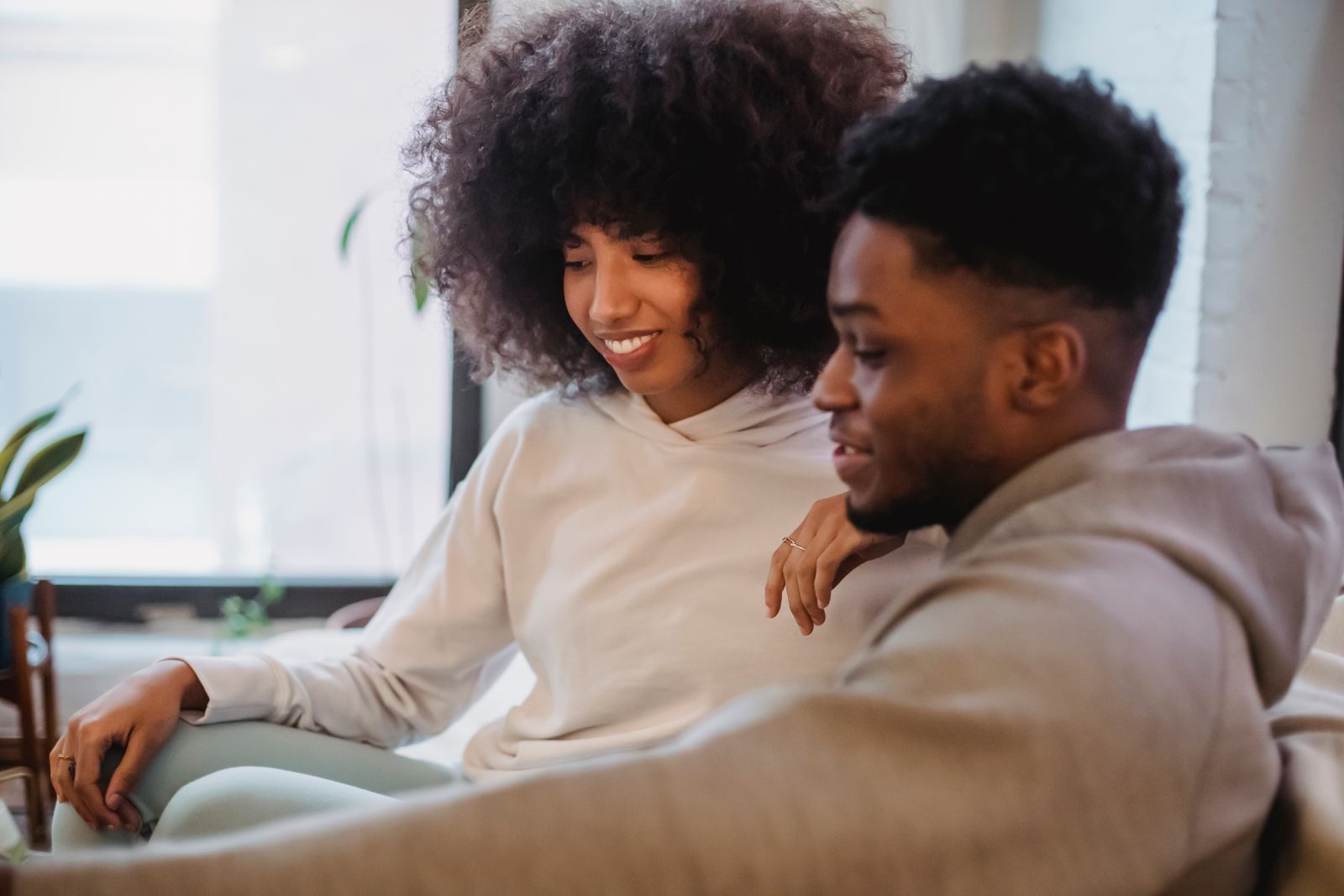 A couple at home setting a monthly send