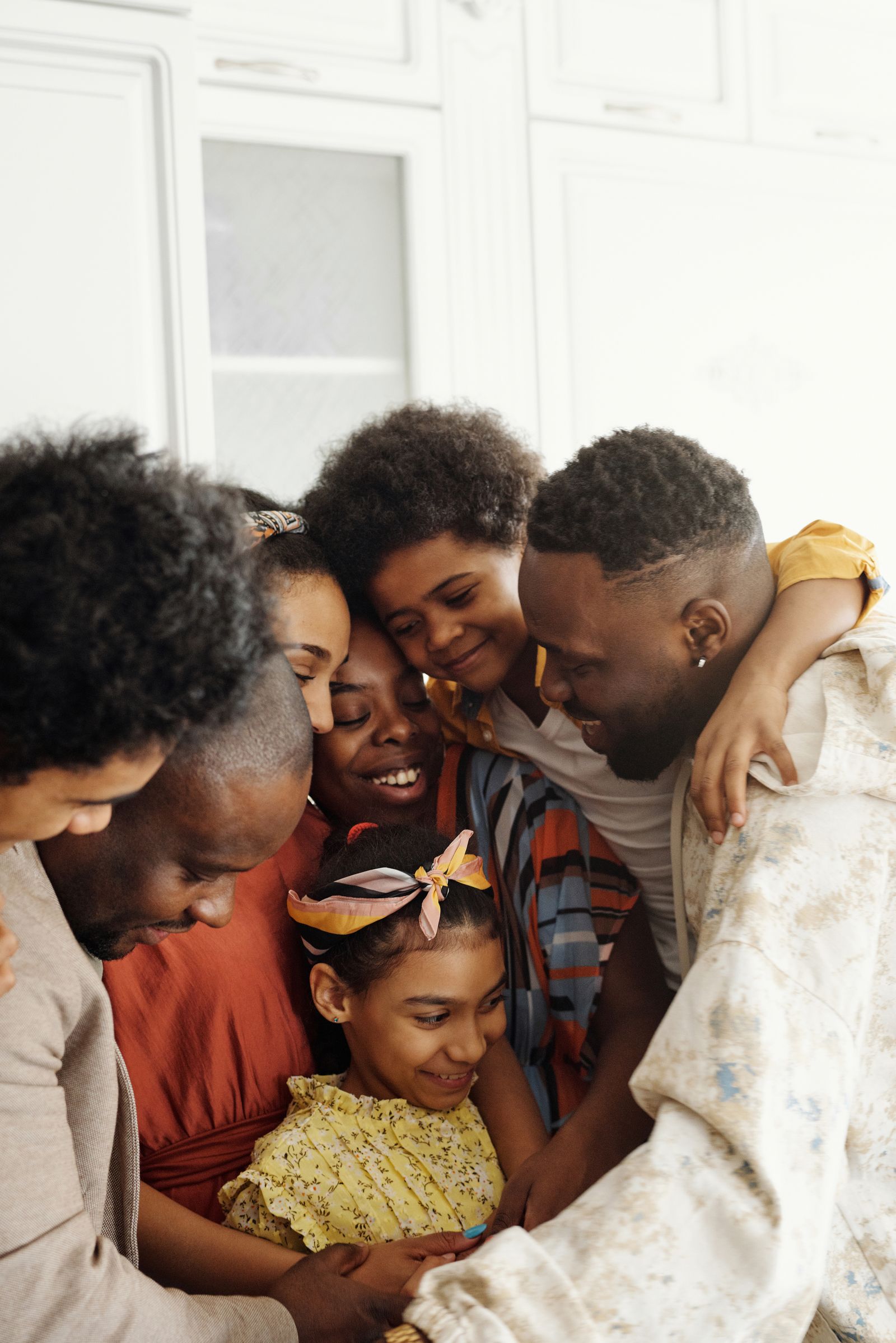 Family gathered close at home in a bright kitchen