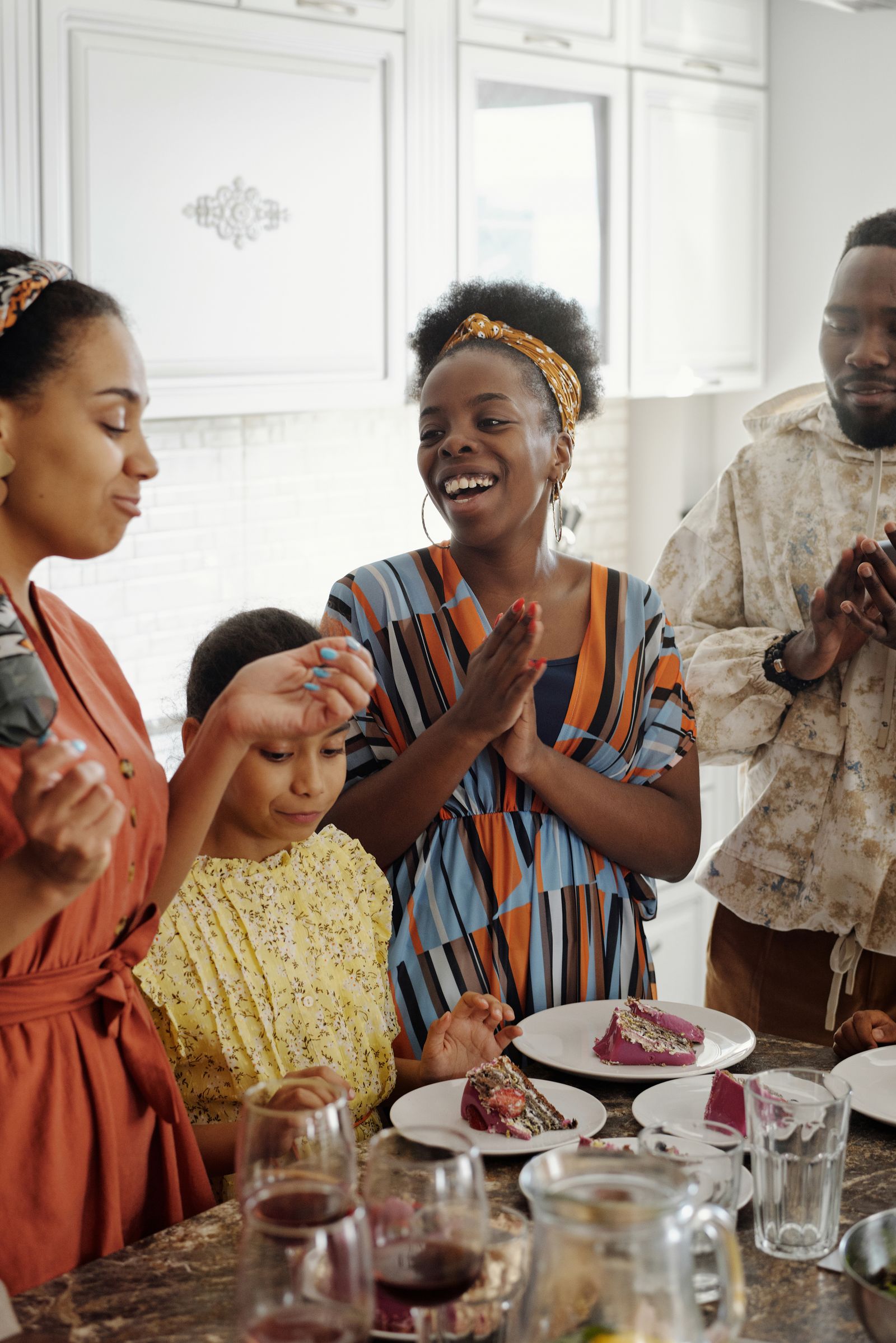 Family celebrating together at home — the moment FamLink is built for